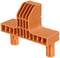 An orange plastic component with vertical and horizontal grooves, which is likely part of a larger modular system.