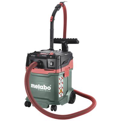 Industrial vacuum cleaner in green and black with red accents, large wheels and long hose. 'Metabo' brand name on the container.