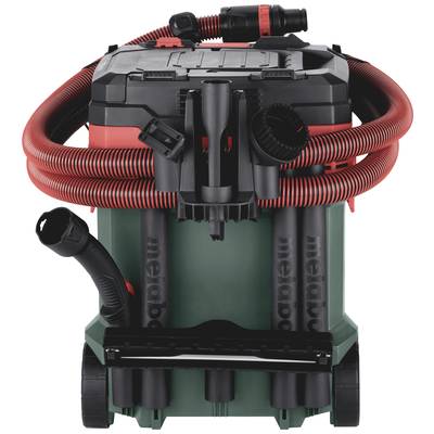Industrial vacuum cleaner with a red suction hose, black lid and green drum on wheels. 'Metabo' branding visible.
