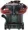 Industrial vacuum cleaner with a red suction hose, black lid and green drum on wheels. 'Metabo' branding visible.