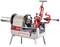 A pipe threading machine with a steel pipe clamped into the cutting device, mounted on a metal stand.