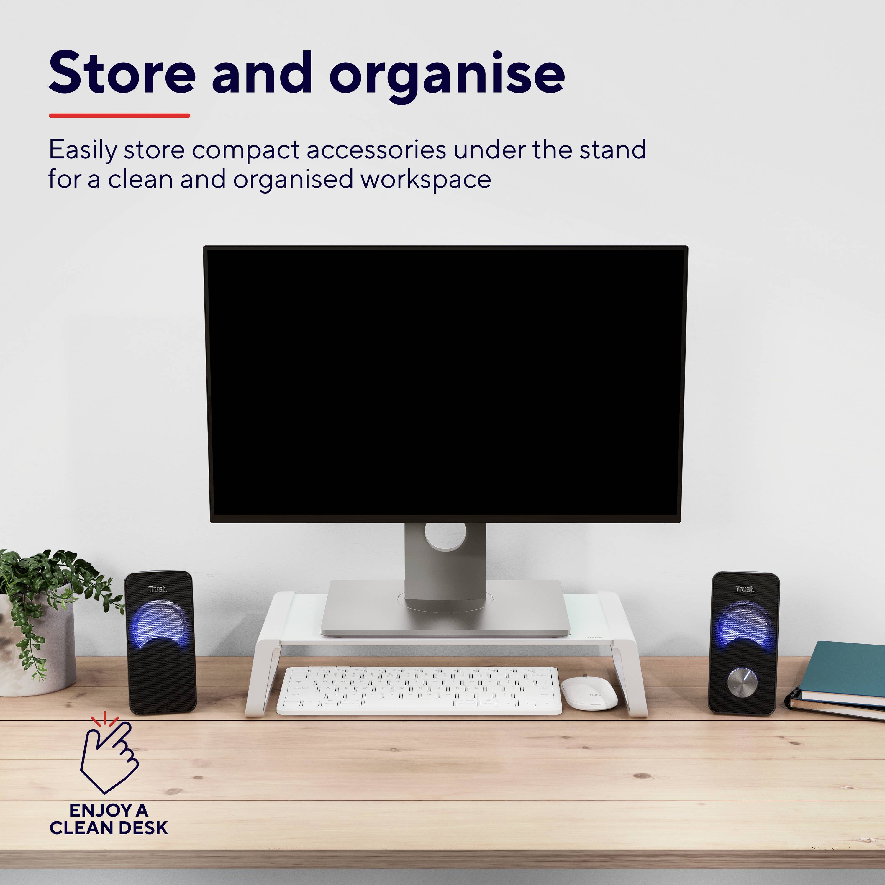 A computer screen on a desktop stand with a keyboard underneath. Speakers are positioned on the left and right. Text reads 'Store and organise'.