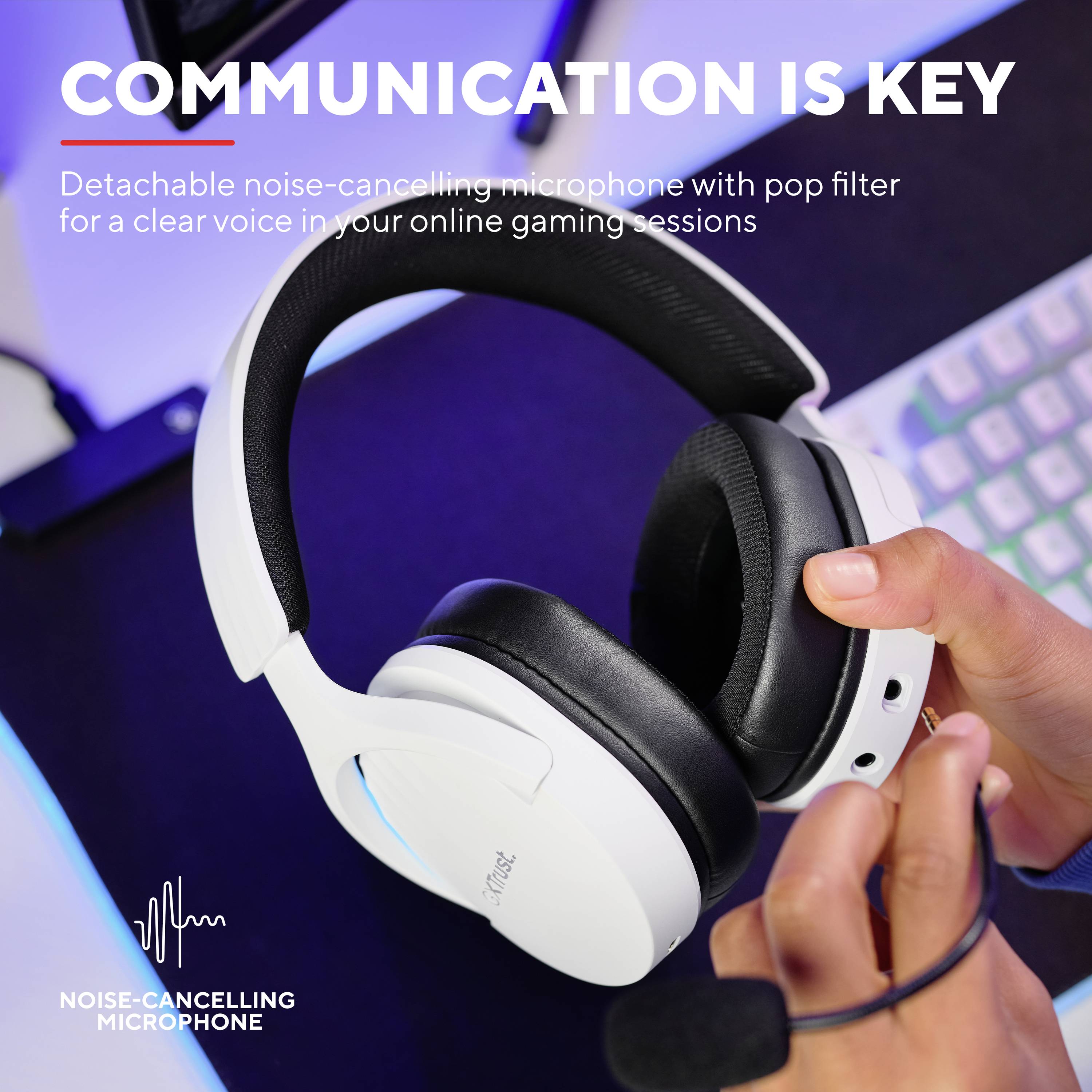 Headphones and microphone with noise-cancelling function in close-up. Text: 'Communication is the be-all and end-all' for gaming sessions.