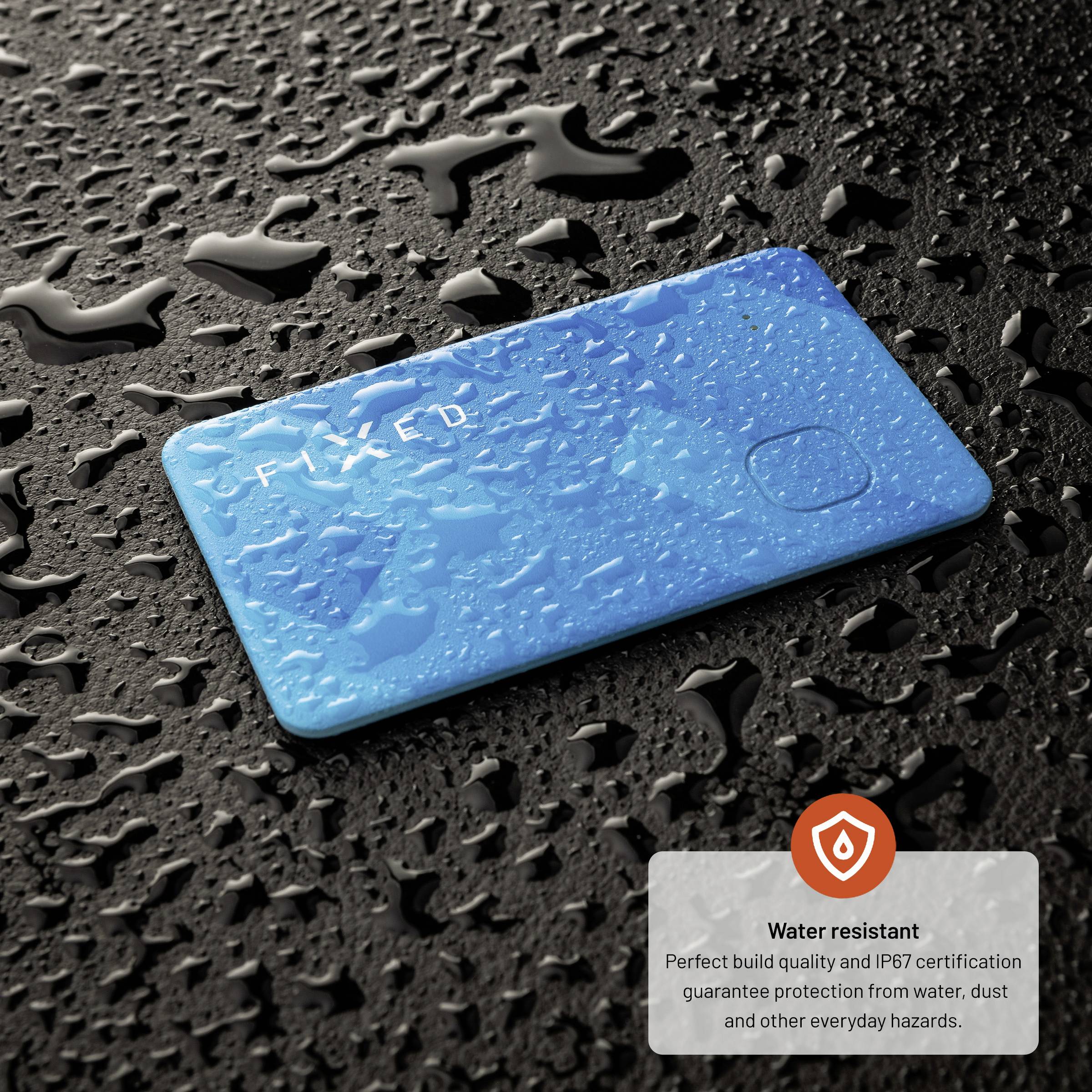 A blue, water-resistant card with raindrops lies on a wet surface. Text shows water resistance and IP67 certification.