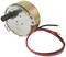 'A small electric motor with a round metal casing and two exposed cables in red and black.'