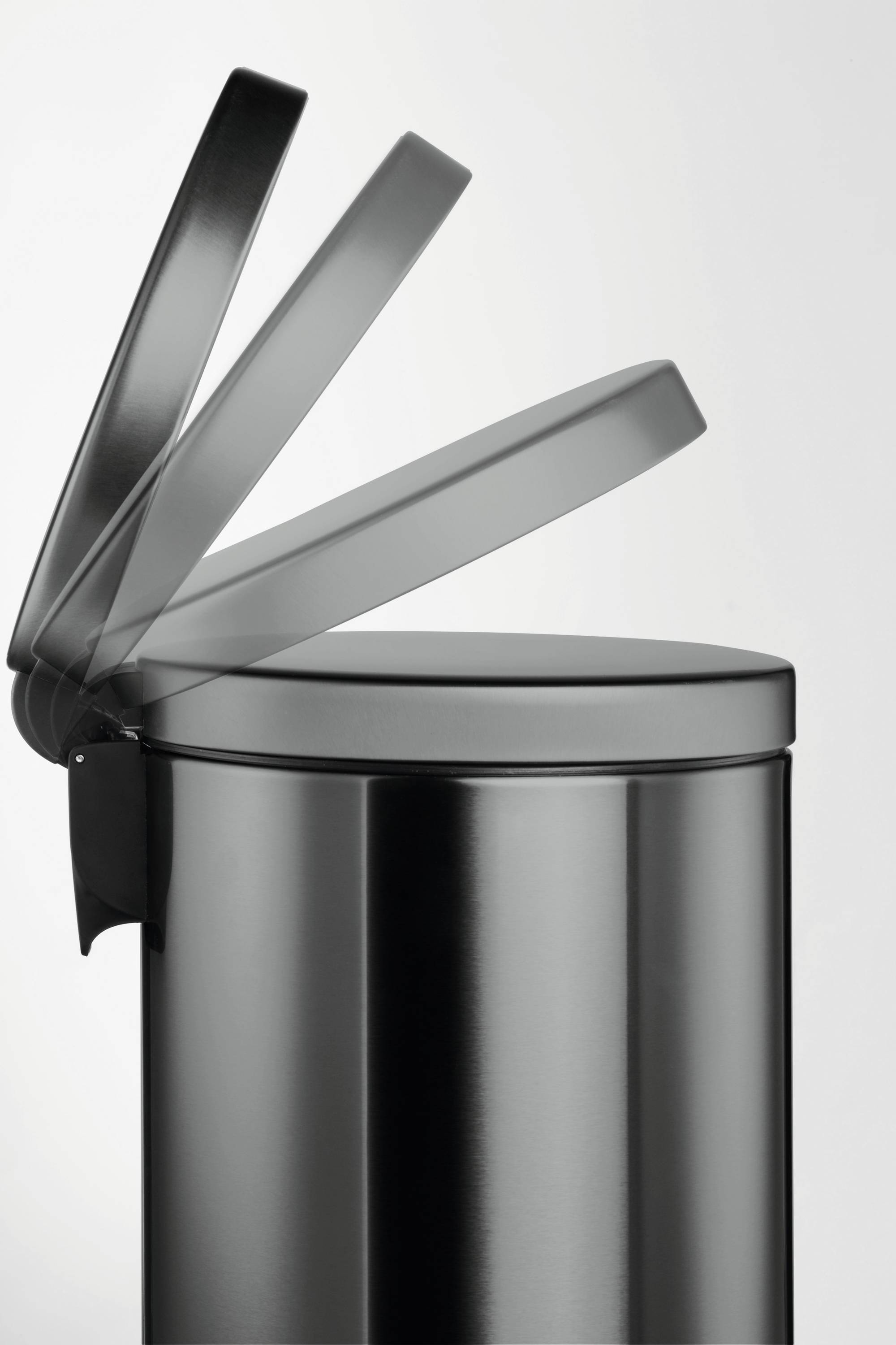 A matte silver rubbish bin with a half-open lid on a white background.
