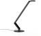A modern, black desk lamp with a sleek, angular design on a round base.