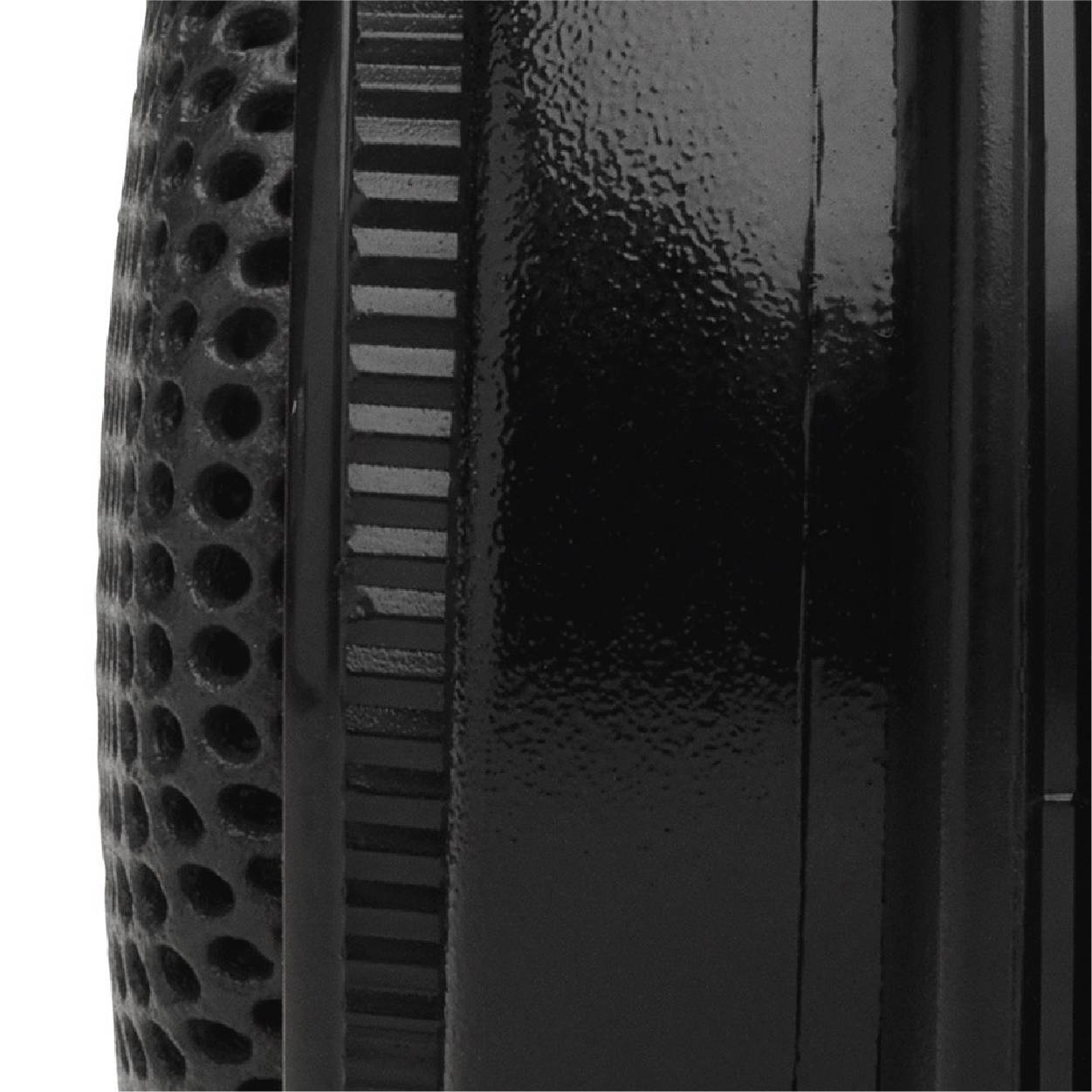 Close-up of a structured, cylindrical object in black with a glossy and a matte texture.