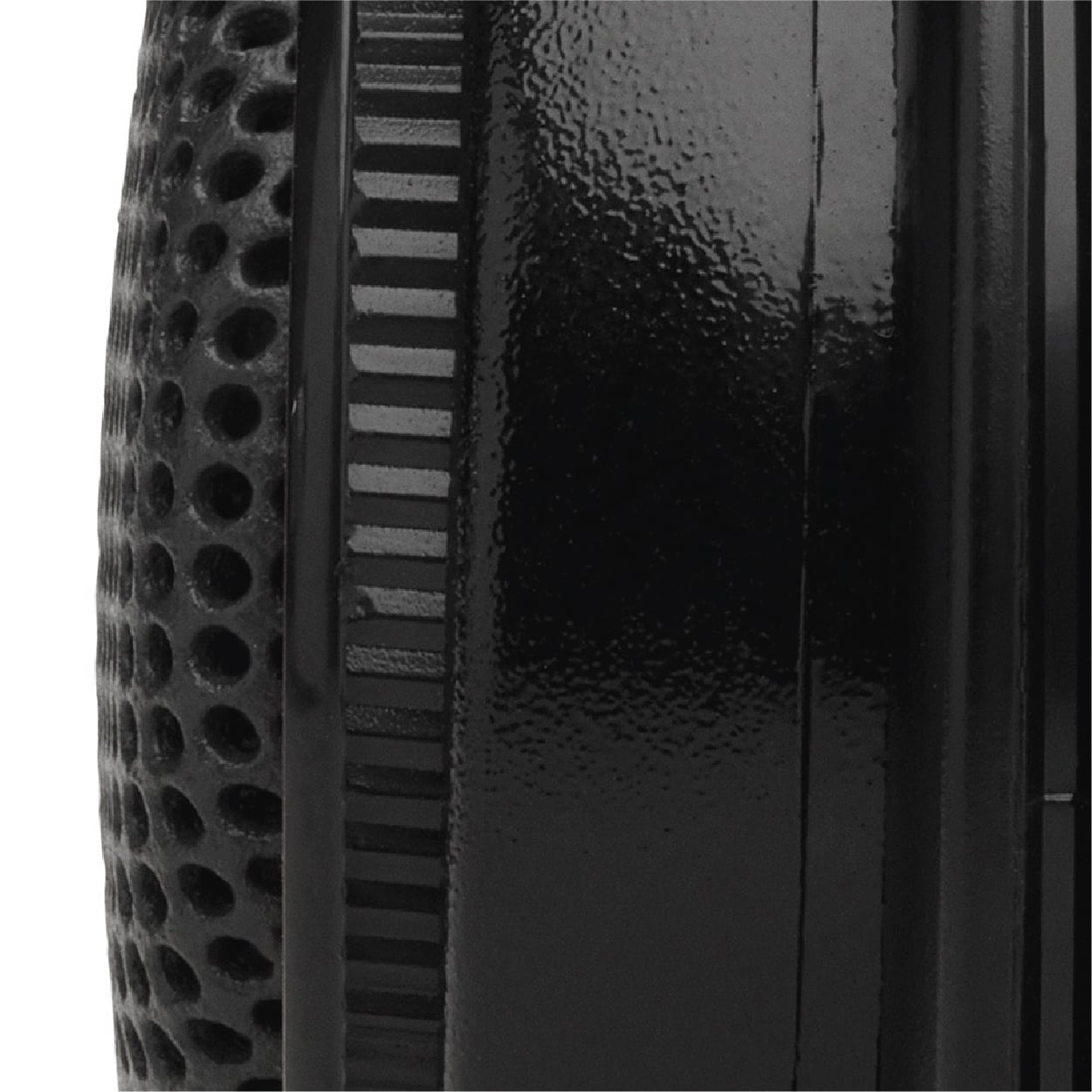 Close-up of a structured, cylindrical object in black with a glossy and a matte texture.