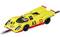 A yellow toy racing car in a retro style, with the number 43 and Shell logo, positioned on a toy car racing track.