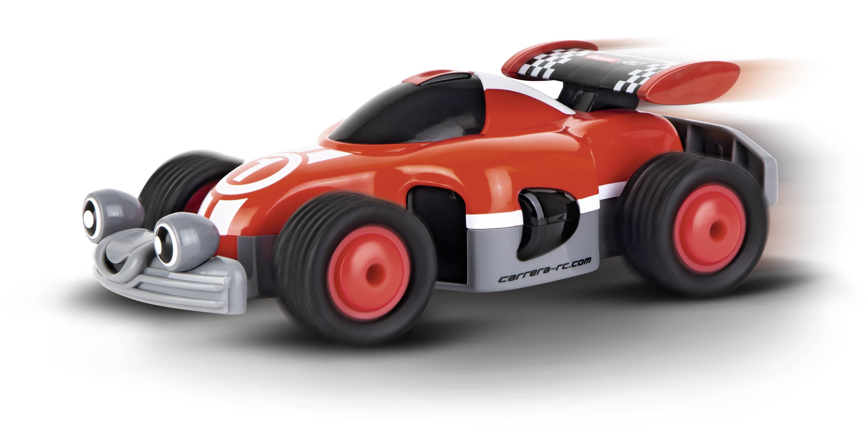 A red toy car with large tyres and a curved spoiler moves quickly to the right. It has cheerful googly eyes.