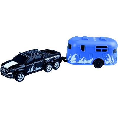 Black toy car with six wheels pulls blue caravan decorated with mountain motifs.