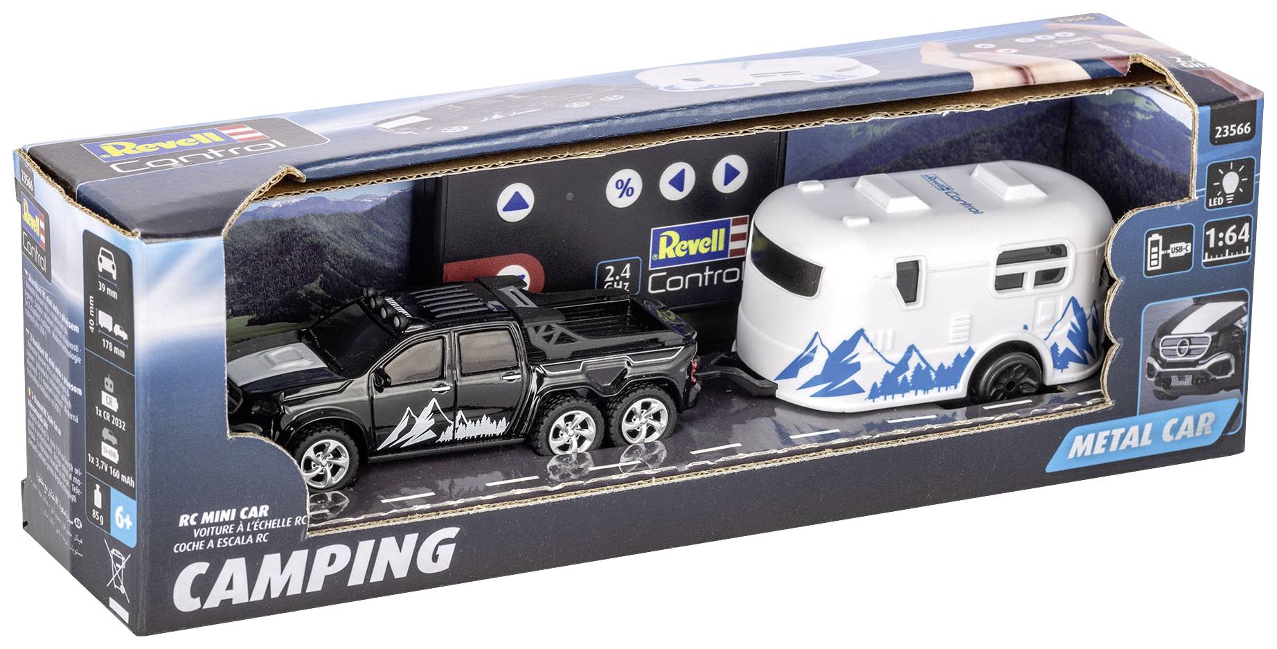 Packaging featuring a black toy pickup truck and a white caravan with blue mountain-themed graphics. 'Revell' brand name visible.