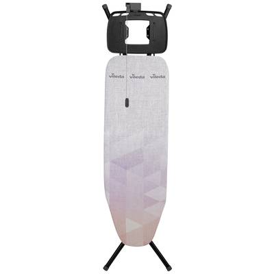 Ironing board with a grey and pink geometric pattern. Top shelf for holding an iron.