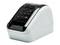 A small, white label printer with multiple buttons and a display on the top surface. Ideal for printing address labels.
