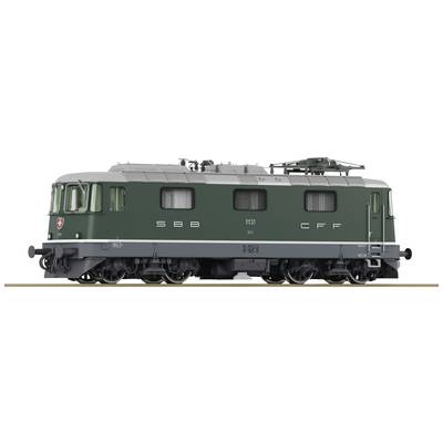 Green locomotive with SBB-CFF logo, side view. Number 11373. It is standing on railway tracks, without any visible surroundings or people.