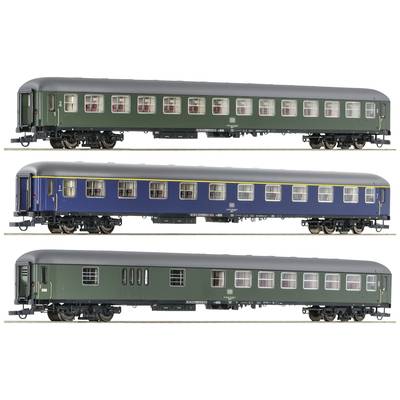 Three model railway passenger carriages in different colours: Green with a black roof, blue with a yellow stripe, and dark green.