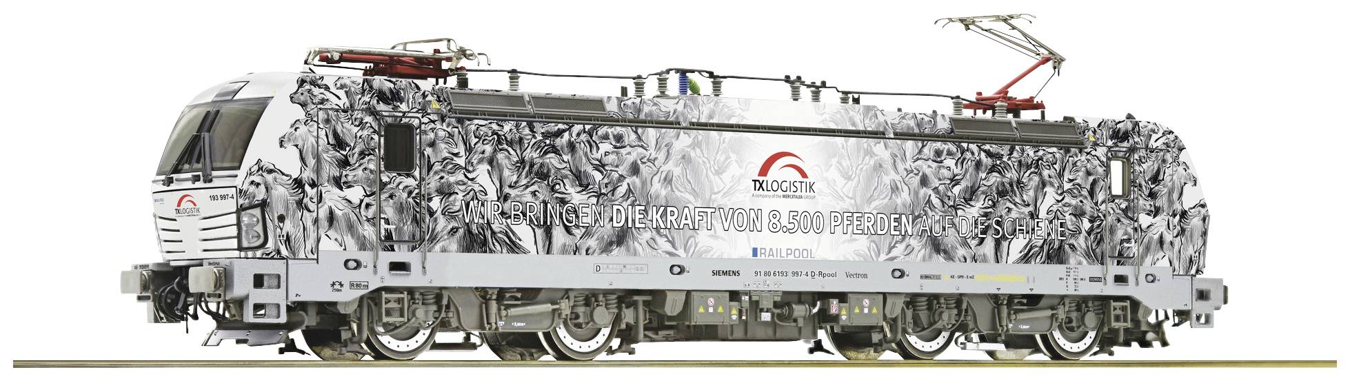 A modern locomotive with a striking black and white design and company logos, displaying the inscription 'TRAKO 2023 Zeller+Gmelin'.