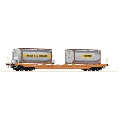 Freight train wagon with two silver tank containers of the brand 'Bertschi AG'. The containers are loaded on an open flatbed wagon.