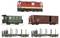 A model train set with a red locomotive, a green passenger carriage, a brown goods wagon, and two black flatbed wagons.