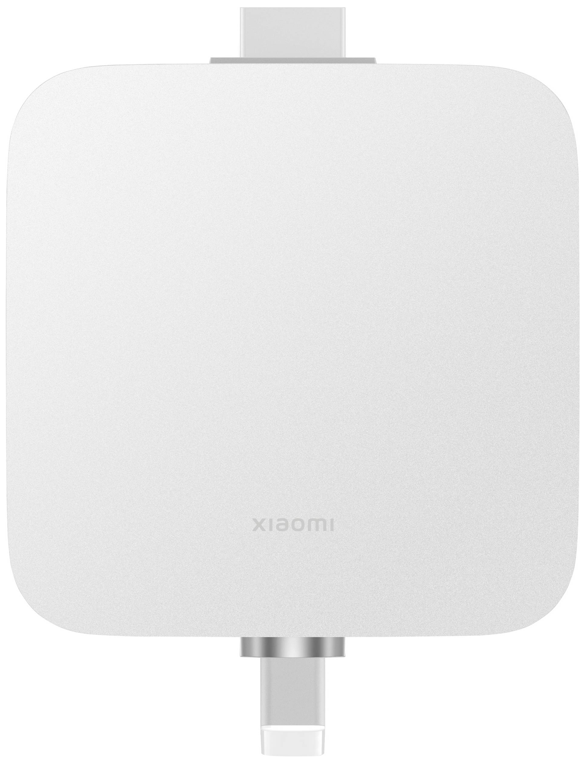 A white electrical device with a rectangular shape and rounded corners. Connections are located at the top and bottom.