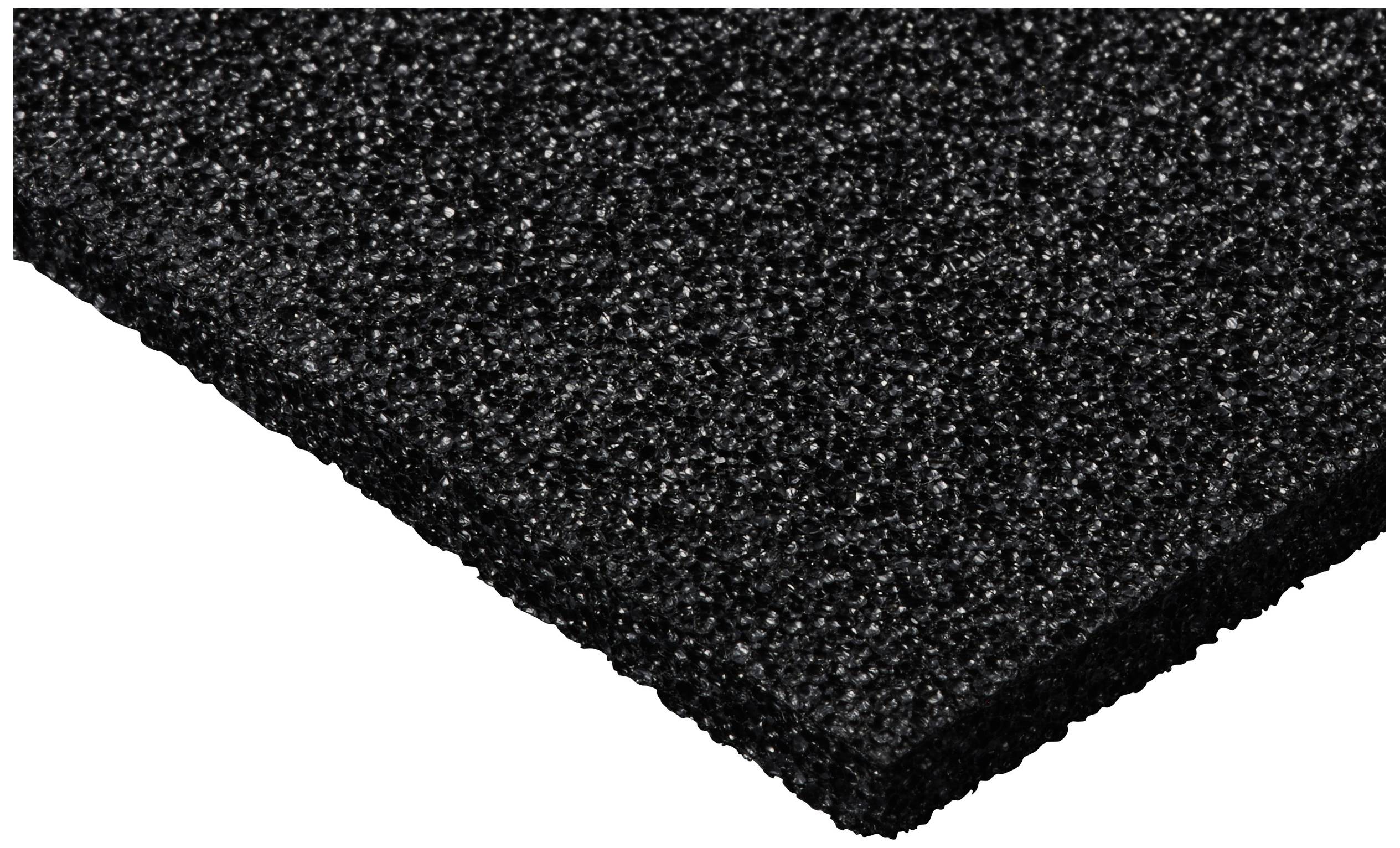 Black rubber mat with a rough surface, rectangular and thin, taken from a slightly side-on perspective.