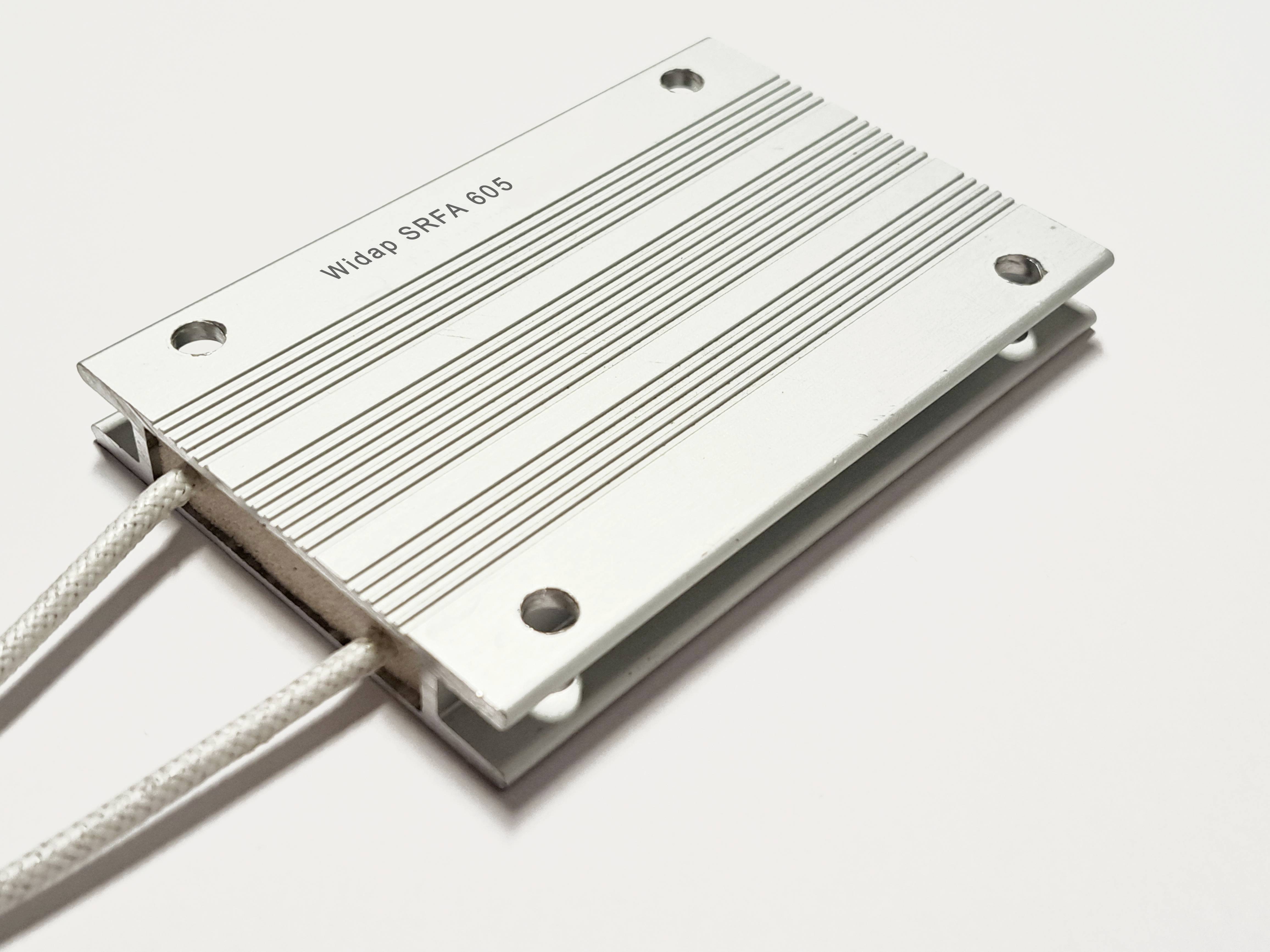 Rectangular aluminium plate with a striped pattern and four screw holes, two white cables protruding on the left, labelled 'Widap SRFA 805'.