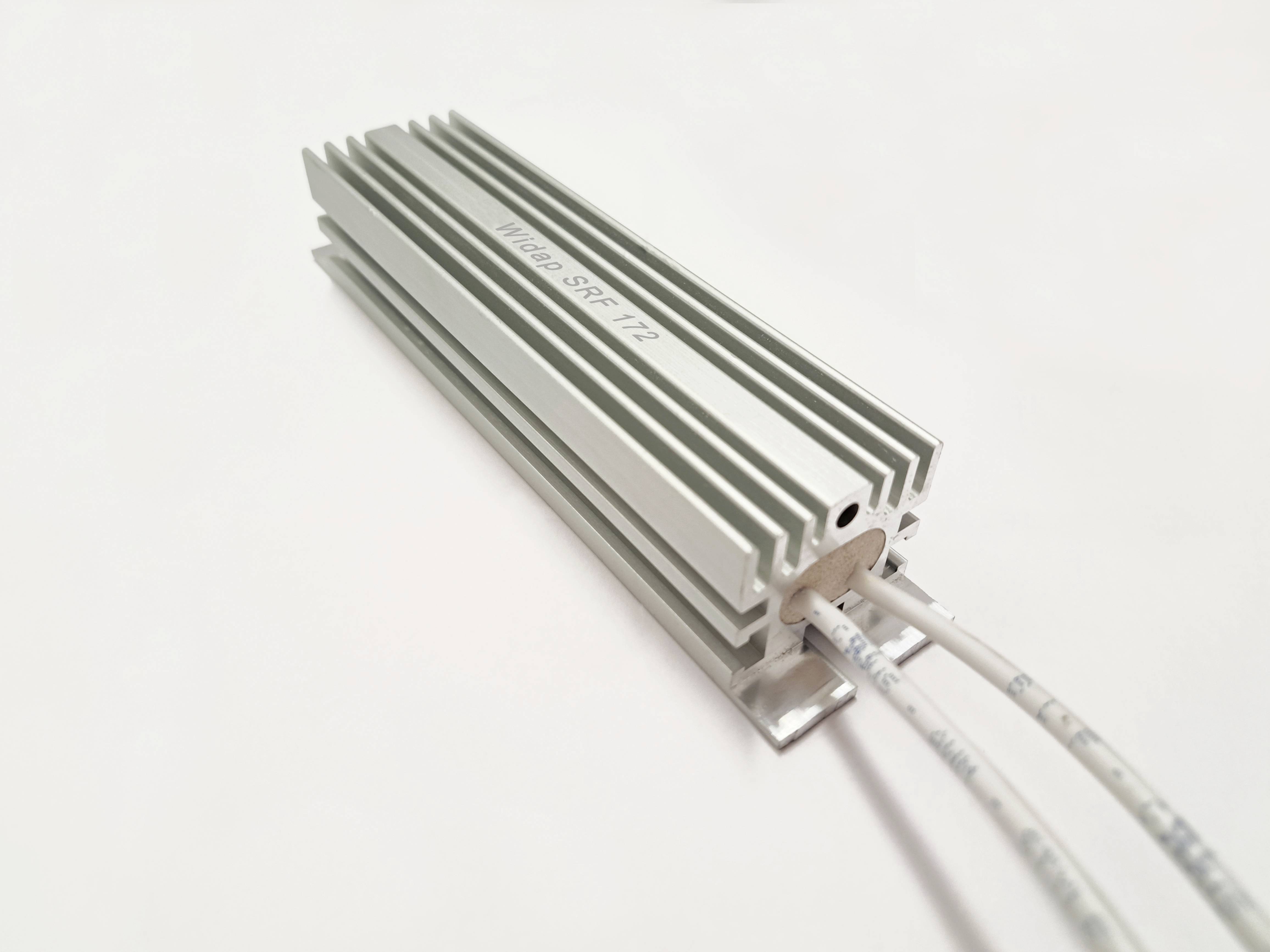 A silver, rectangular heatsink with grooves and two cables. Label 'VHS20 SRF T2' on the top surface.