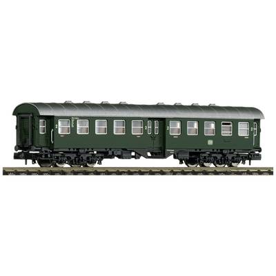 A green second-class model railway carriage, with detailed windows and doors, stands on a track.