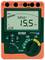 Digital insulation measurement device with display values: Voltage 5856 V and Resistance 15.5 MΩ. Contains buttons for mode and measurement.