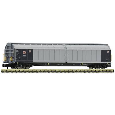 A closed goods wagon on a section of railway track. The wagon is grey and displays the logo of a railway company.
