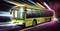 A yellow electric bus drives dynamically across a colourful, blurred street. Lights and colour streaks create a sense of speed.