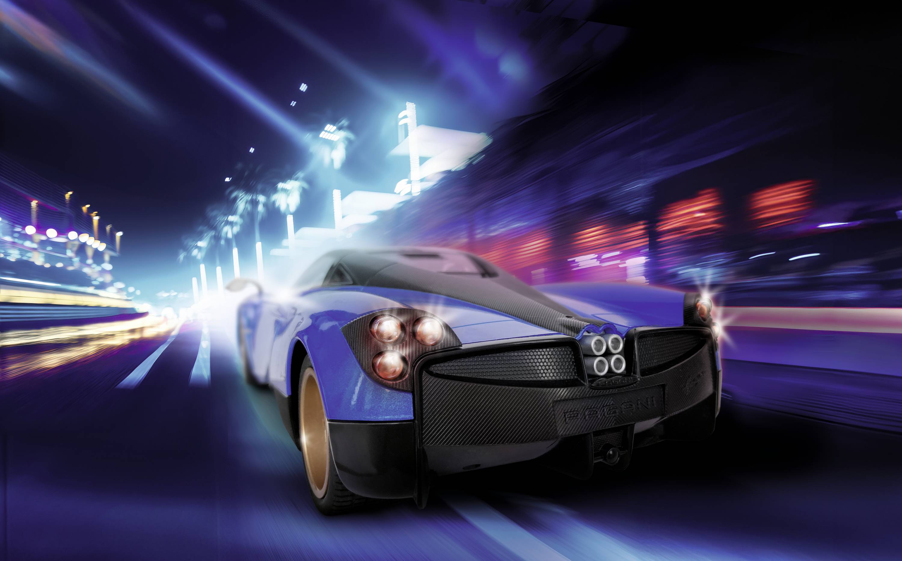 A blue sports car speeds through an illuminated city street. Lights and movements create dynamic effects.