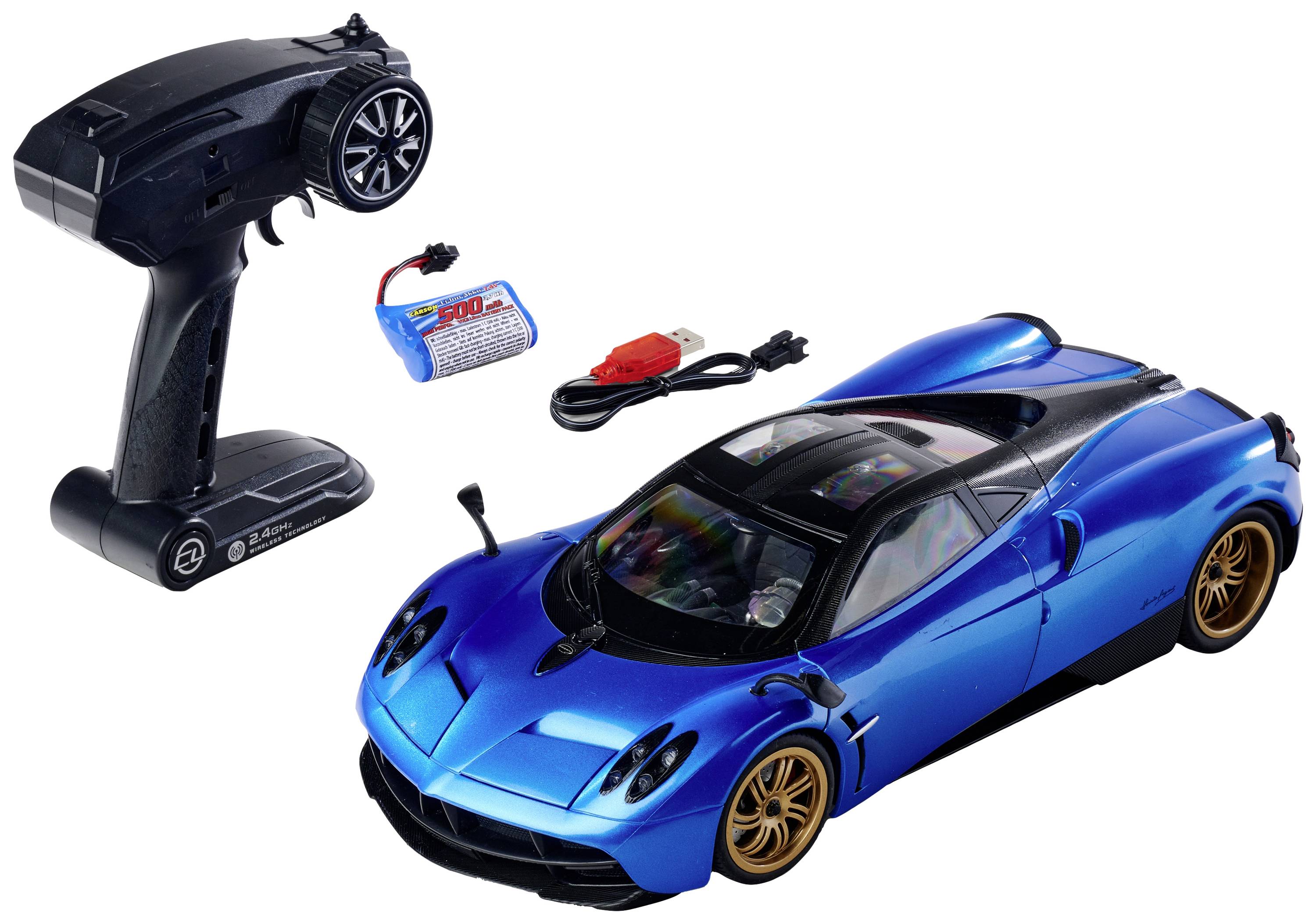 Blue remote-controlled car with gold wheels and a black remote control. A battery and a USB charging cable are placed beside it.