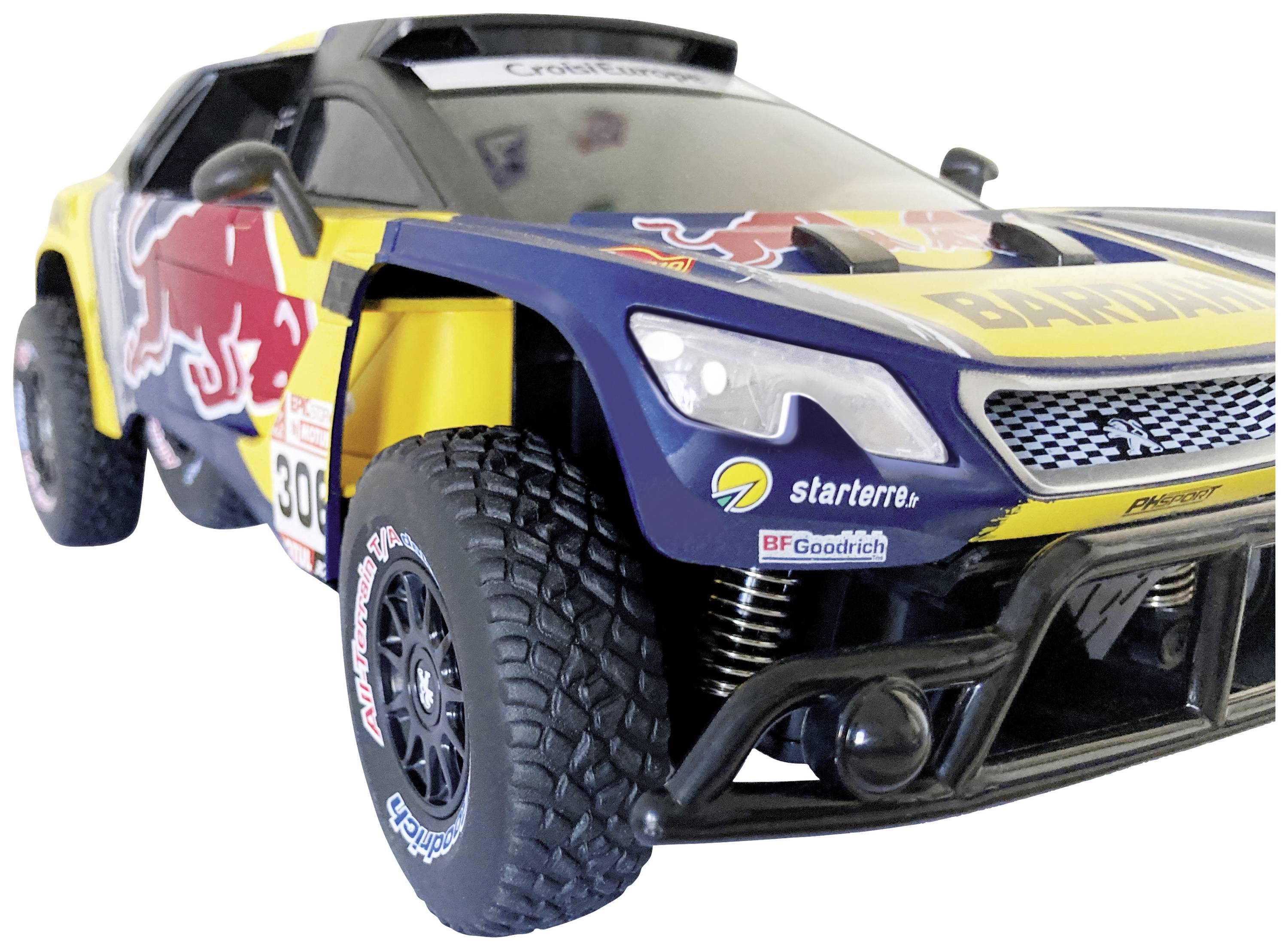 A yellow and blue toy car with racing stickers and large off-road tyres, reminiscent of a rally vehicle.