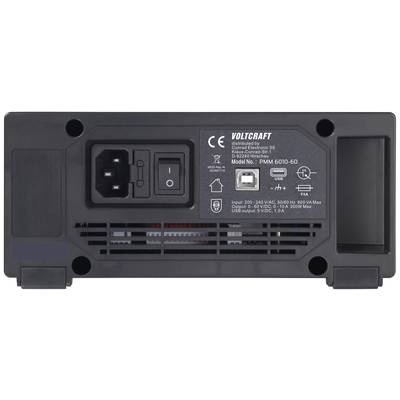 Back of a black Voltcraft power supply with connections and USB port. Technical data and model labels are visible.