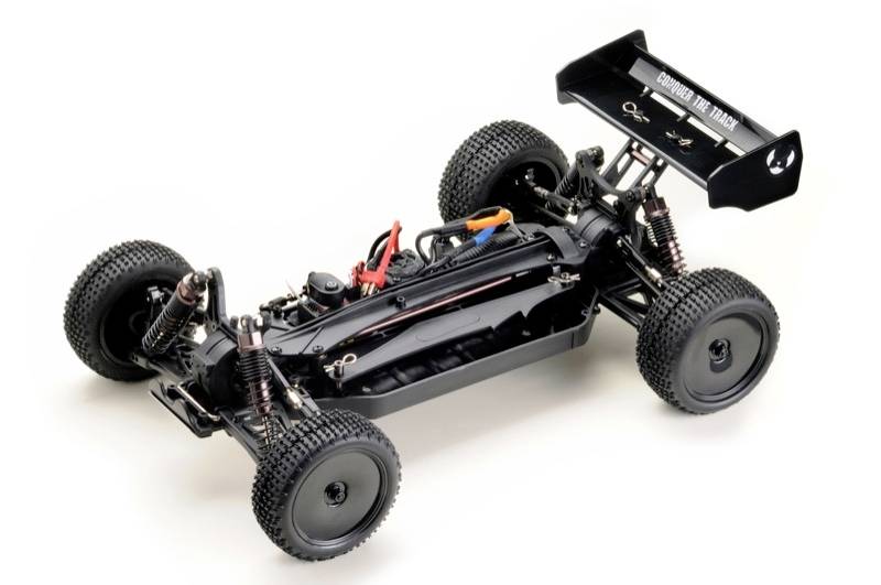 Black RC car chassis with off-road tyres and rear spoiler, focusing on robust chassis and shock absorbers for terrain driving.
