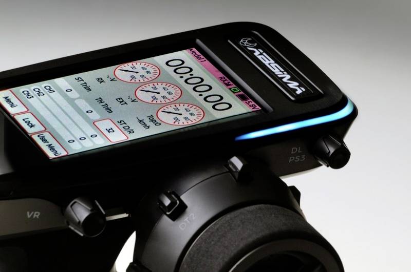 A digital device with a screen displays three red dials with readings and a large display '00:00.0'.