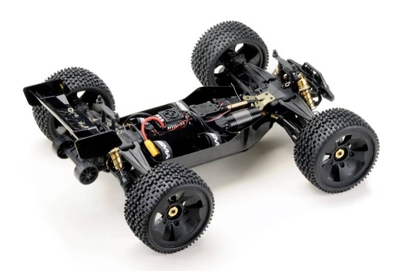 'A remote-controlled car chassis without bodywork reveals the internal detailed work, including the engine and suspension springs.'