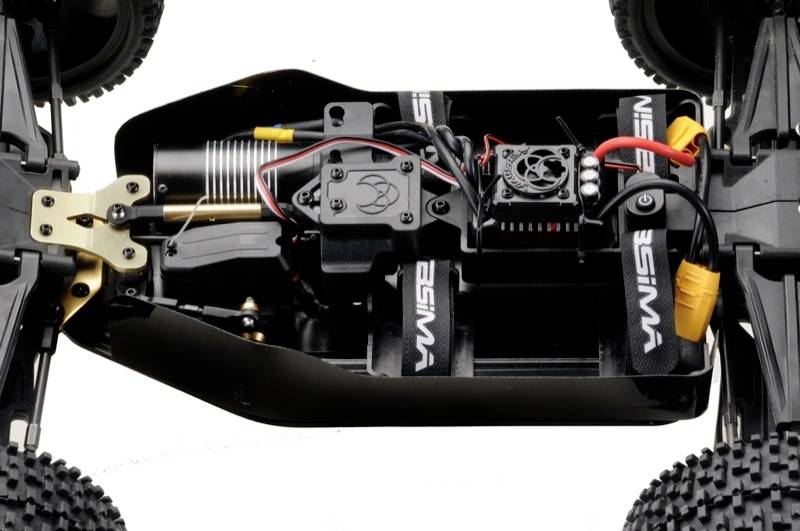 Interior view of a remote-controlled car showing the engine and electronics. Cable connections and fan are visible.