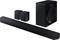 Black soundbar with two speakers and subwoofer. Modern design, suitable for home cinema audio experiences.