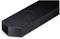 Black soundbar with a slim, modern design and side-visible speaker grille.