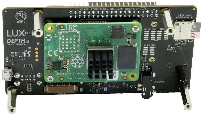 An electronic circuit board with various components, including a green module marked with a raspberry symbol, identified as a Raspberry Pi.