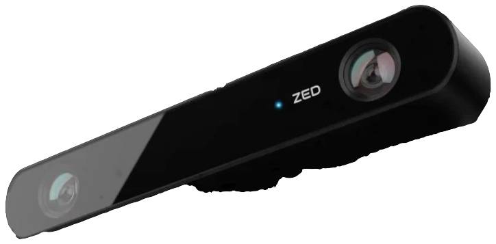 A black, rectangular 3D camera with two lenses and the inscription 'ZED'. It is used for depth perception and image processing.