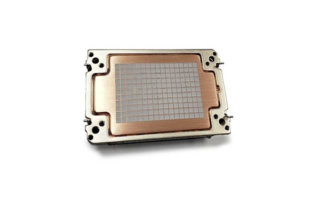 A computer processor on a white background. It has a metallic casing with a copper-coloured surface and visible pins.