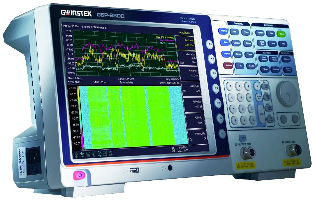 An oscilloscope displays multiple waveforms on a screen. It is used for signal analysis. Buttons are visible on the right side.