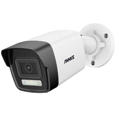A surveillance camera with a rectangular housing is mounted on a wall.