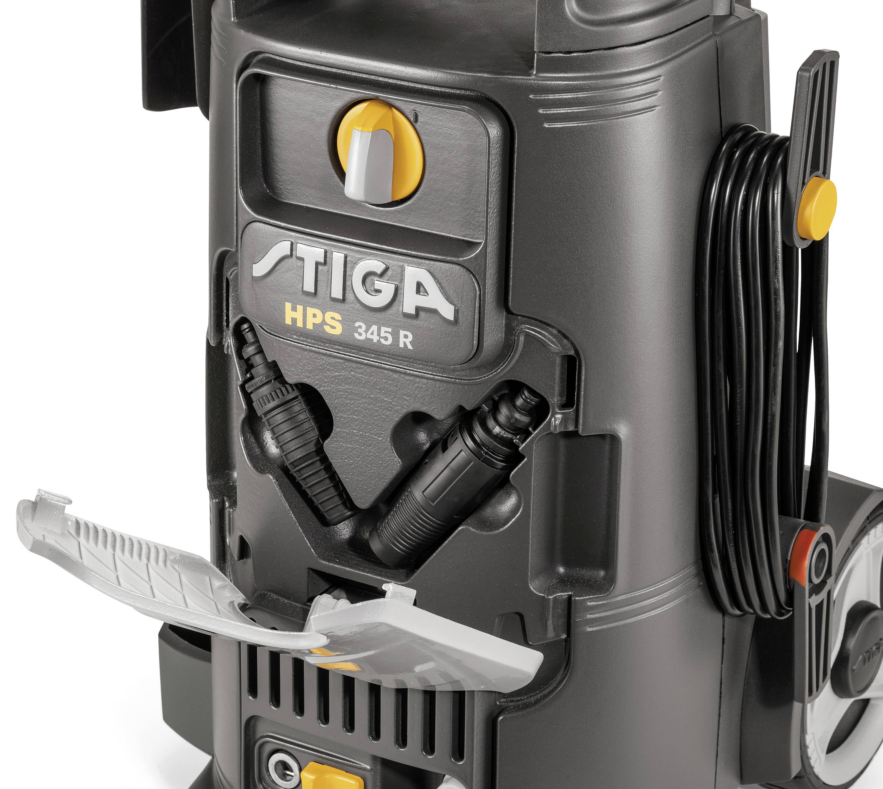 'Detailed close-up of a Stiga HPS 345 R pressure washer. Shows front hoses, cable holder and an opened compartment.'