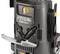 'Detailed close-up of a Stiga HPS 345 R pressure washer. Shows front hoses, cable holder and an opened compartment.'