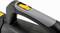 Close-up of a black and grey vacuum cleaner handle with a yellow button, used for operating a portable vacuum cleaner.
